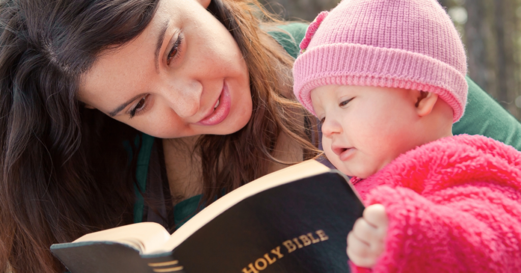 Mom Reading Bible with Baby